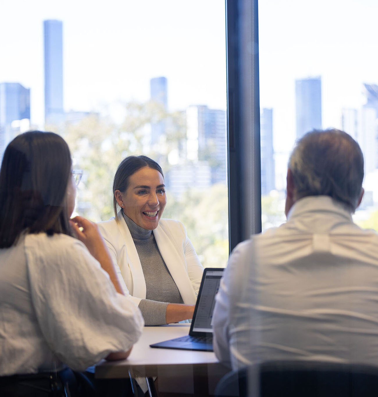 Office lady running through a presentation on a laptop