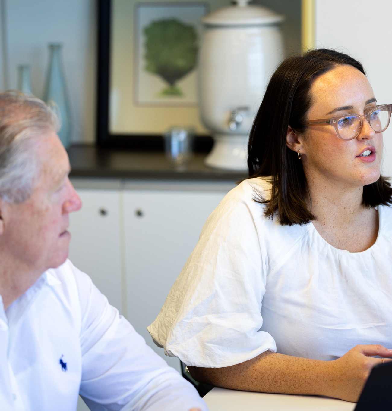 Office lady running through a presentation on a laptop